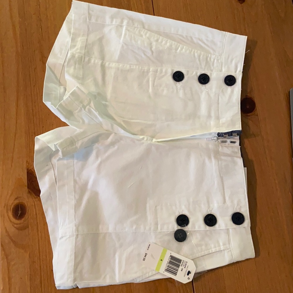 Nautica White 4” Inseam. 98% cotton.